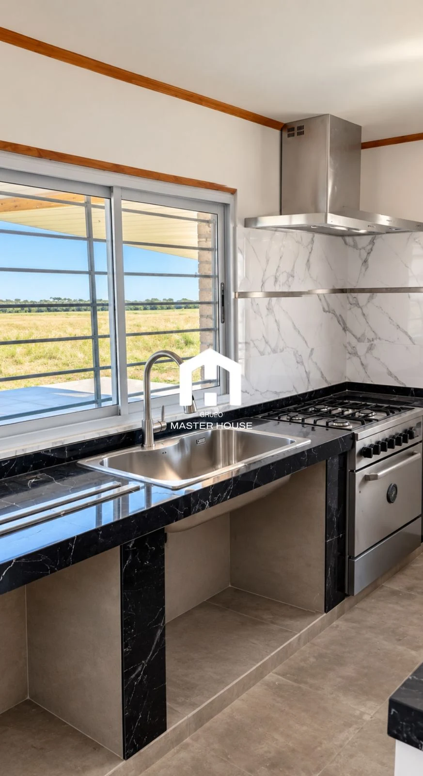Interior real de una cocina de Grupo Master House